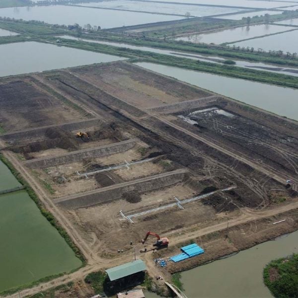 a drone view of large fish ponds under construction